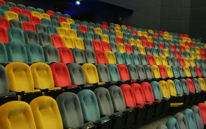 Empty IMAX theater with multicolored seats