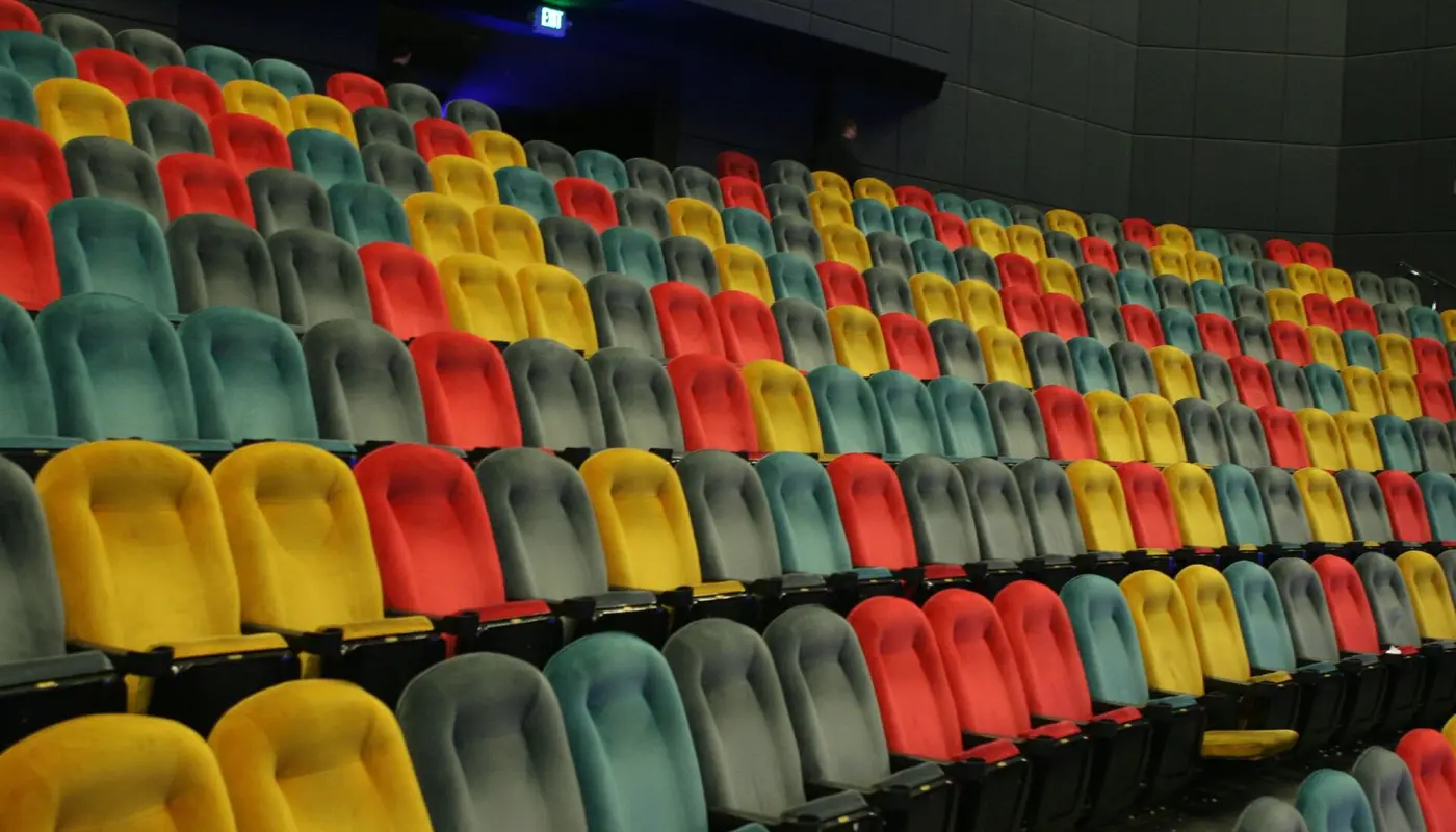 Empty IMAX theater with multicolored seats